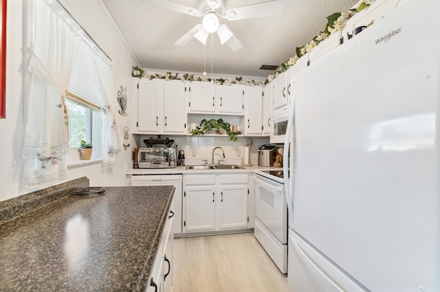 1225 NW 21st St Unit 7-710, Stuart, FL 34994 - kitchen featuring white appliances, a sink, ceiling fan, white cabinetry, and a textured ceiling
