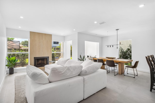 6734 Canary Palm Cir, Boca Raton, FL 33433 - living room featuring recessed lighting, healthy amount of natural light, baseboards, and a fireplace