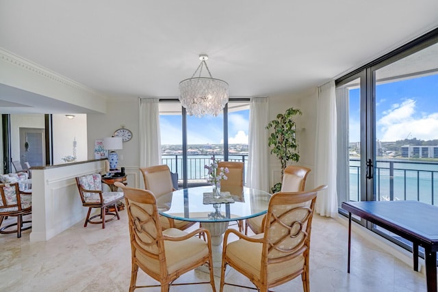 19850 Beach Rd Unit 8D, Jupiter, FL 33469 - dining room featuring expansive windows, a chandelier, a water view, and ornamental molding