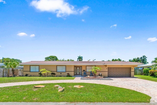 2070 NE 27th St, Lighthouse Point, FL 33064 - single story home with curved driveway, stucco siding, a garage, and a tile roof