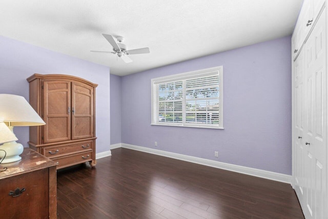 2070 NE 27th St, Lighthouse Point, FL 33064 - unfurnished bedroom featuring a closet, dark wood finished floors, and a ceiling fan