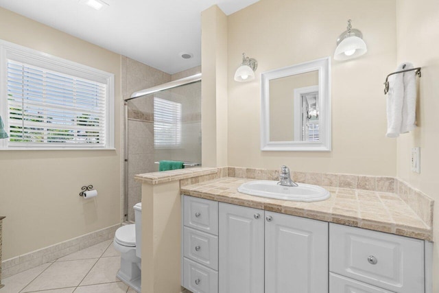2070 NE 27th St, Lighthouse Point, FL 33064 - bathroom featuring vanity, tile patterned floors, and tiled shower
