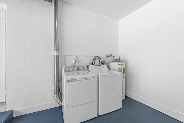 2070 NE 27th St, Lighthouse Point, FL 33064 - washroom with water heater and washing machine and clothes dryer