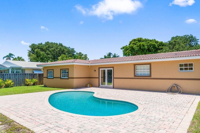 2070 NE 27th St, Lighthouse Point, FL 33064 - view of pool featuring french doors and a patio area
