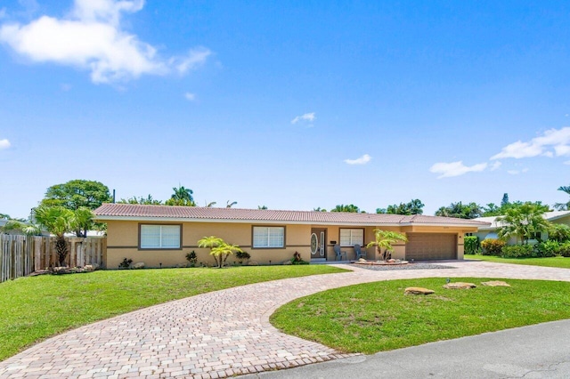 2070 NE 27th St, Lighthouse Point, FL 33064 - ranch-style home with curved driveway, stucco siding, a tiled roof, and a garage