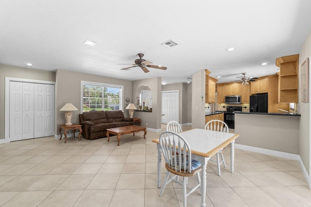 2070 NE 27th St, Lighthouse Point, FL 33064 - dining area with a ceiling fan, light tile patterned flooring, recessed lighting, and arched walkways