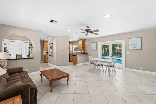 2070 NE 27th St, Lighthouse Point, FL 33064 - living room featuring a ceiling fan, light tile patterned flooring, recessed lighting, and french doors