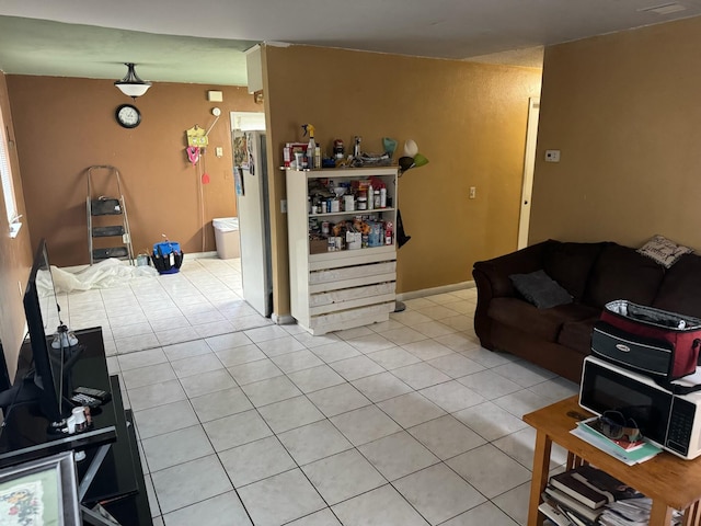 4601 Lake Ave, West Palm Beach, FL 33405 - living area featuring light tile patterned floors