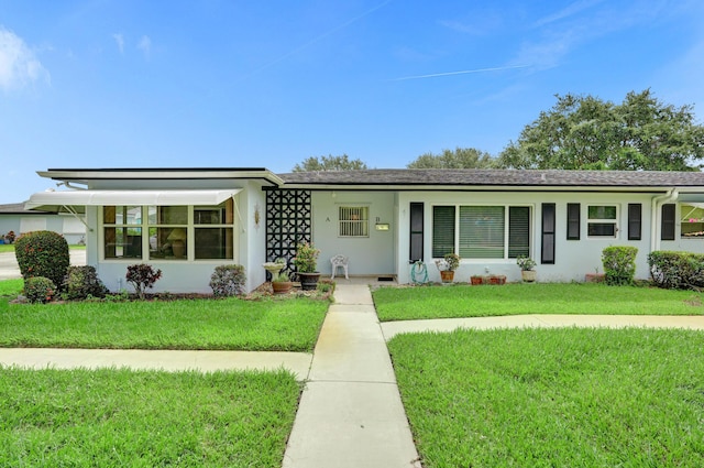 505 High Point Blvd N Unit A, Delray Beach, FL 33445 - ranch-style home with a front lawn and stucco siding
