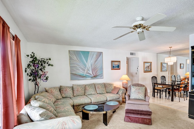 505 High Point Blvd N Unit A, Delray Beach, FL 33445 - living room with a ceiling fan, a textured ceiling, light colored carpet, and light tile patterned floors