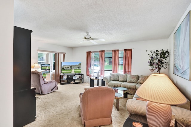 505 High Point Blvd N Unit A, Delray Beach, FL 33445 - living room with a textured ceiling, ceiling fan, light carpet, and healthy amount of natural light