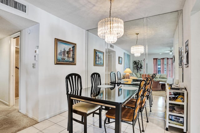 505 High Point Blvd N Unit A, Delray Beach, FL 33445 - dining area with a chandelier, ceiling fan, baseboards, and light tile patterned floors