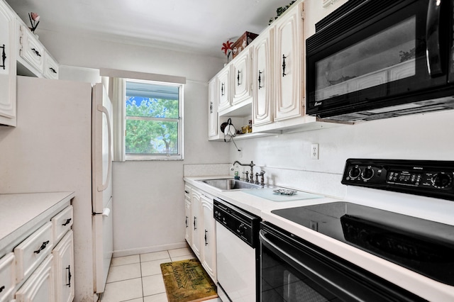 505 High Point Blvd N Unit A, Delray Beach, FL 33445 - kitchen with white appliances, light countertops, white cabinets, a sink, and light tile patterned flooring