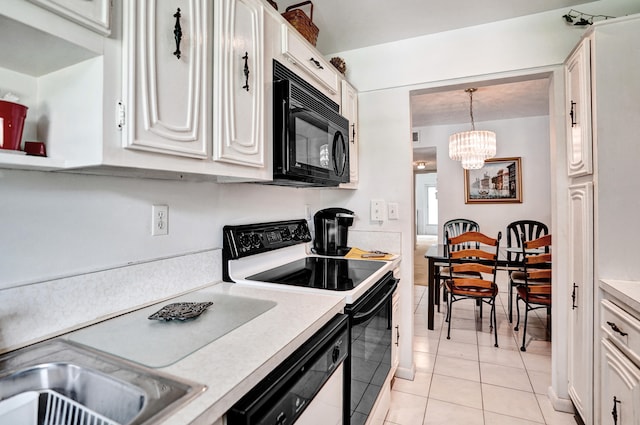 505 High Point Blvd N Unit A, Delray Beach, FL 33445 - kitchen with black microwave, range with electric cooktop, dishwasher, light countertops, and light tile patterned floors