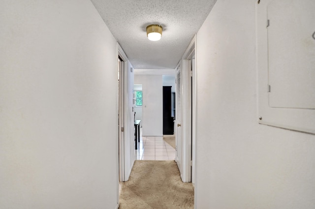 505 High Point Blvd N Unit A, Delray Beach, FL 33445 - hall featuring a textured ceiling and light tile patterned flooring