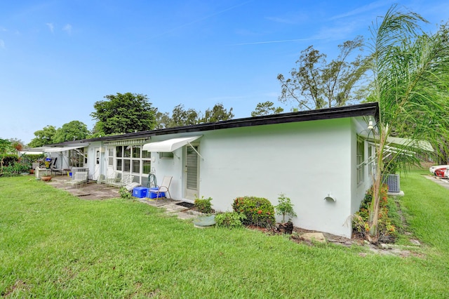 505 High Point Blvd N Unit A, Delray Beach, FL 33445 - back of property with stucco siding and a lawn