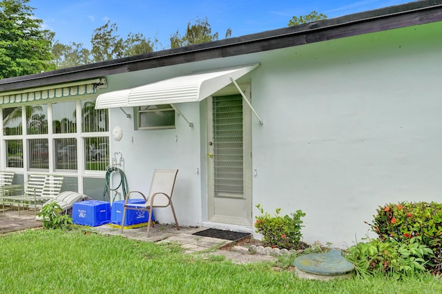 505 High Point Blvd N Unit A, Delray Beach, FL 33445 - view of exterior entry featuring stucco siding