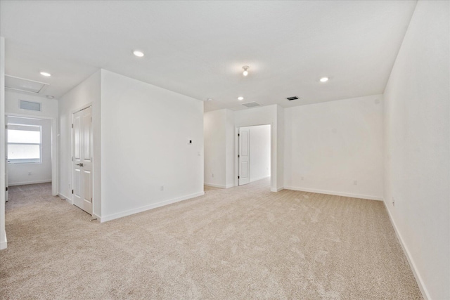 18478 Claybrook St, Jupiter, FL 33458 - spare room featuring light colored carpet, baseboards, recessed lighting, and attic access