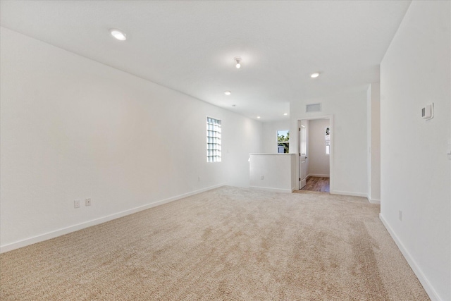 18478 Claybrook St, Jupiter, FL 33458 - spare room featuring light colored carpet, baseboards, and recessed lighting