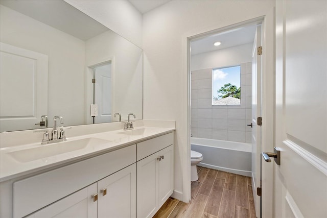 18478 Claybrook St, Jupiter, FL 33458 - bathroom featuring toilet, double vanity, and wood finished floors