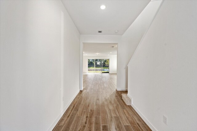18478 Claybrook St, Jupiter, FL 33458 - corridor featuring wood finished floors, baseboards, and recessed lighting
