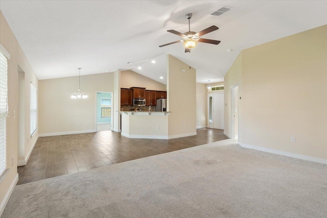3650 SW Parsons St, Port Saint Lucie, FL 34953 - unfurnished living room with light carpet, ceiling fan, a chandelier, baseboards, and high vaulted ceiling