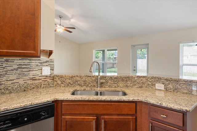 3650 SW Parsons St, Port Saint Lucie, FL 34953 - kitchen with dishwasher, a sink, a ceiling fan, decorative backsplash, and plenty of natural light