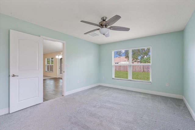 3650 SW Parsons St, Port Saint Lucie, FL 34953 - spare room with carpet, plenty of natural light, baseboards, and a ceiling fan