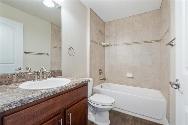 3650 SW Parsons St, Port Saint Lucie, FL 34953 - full bath with wood finished floors, vanity, bathing tub / shower combination, and toilet
