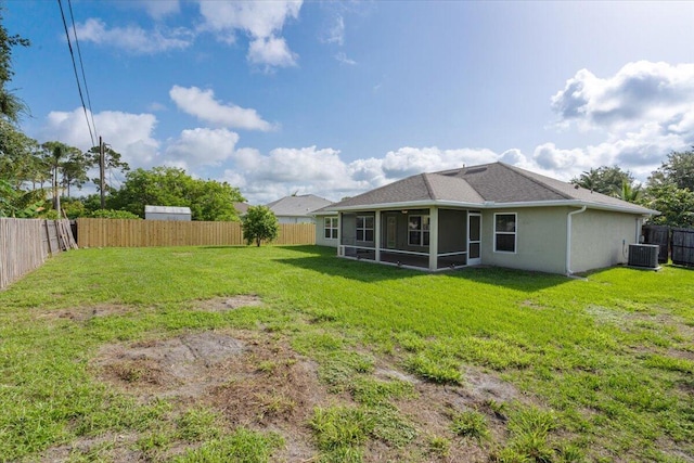 3650 SW Parsons St, Port Saint Lucie, FL 34953 - rear view of house with a sunroom, cooling unit, stucco siding, and roof with shingles