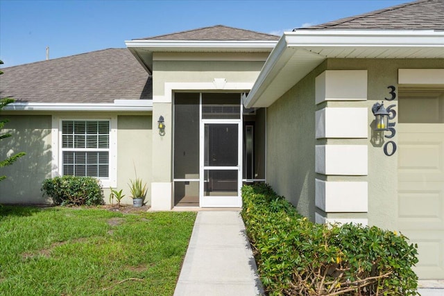 3650 SW Parsons St, Port Saint Lucie, FL 34953 - property entrance featuring roof with shingles, stucco siding, and a garage