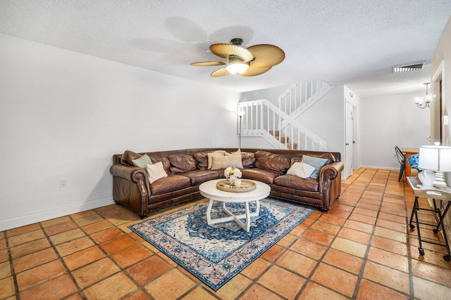 125 1st Ter, Palm Beach Gardens, FL 33418 - living area featuring stairs, a textured ceiling, and a ceiling fan