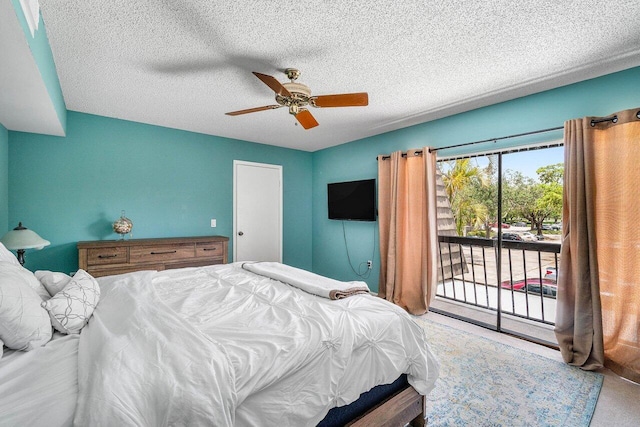 125 1st Ter, Palm Beach Gardens, FL 33418 - carpeted bedroom with access to outside, ceiling fan, and a textured ceiling
