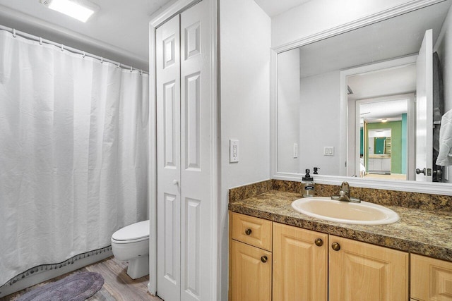 125 1st Ter, Palm Beach Gardens, FL 33418 - full bath with vanity, wood finished floors, and a shower with shower curtain