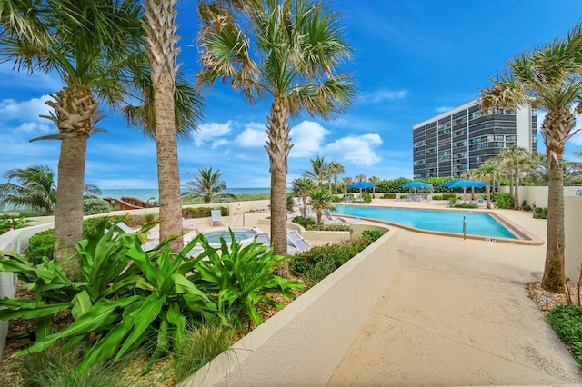 8750 S Ocean Dr Unit 731, Jensen Beach, FL 34957 - community pool featuring a patio area