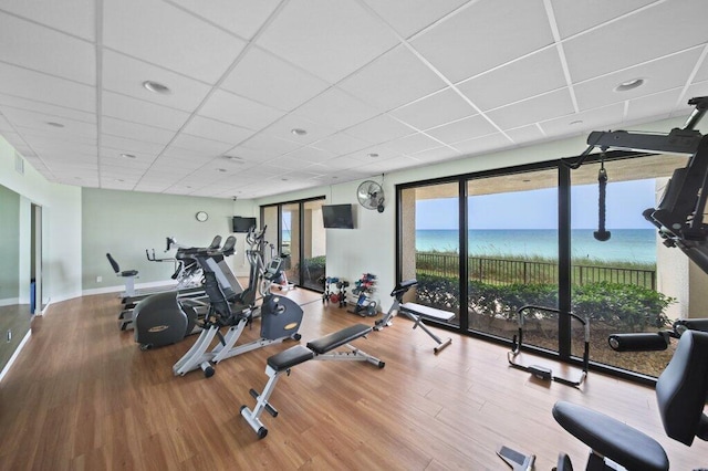 8750 S Ocean Dr Unit 731, Jensen Beach, FL 34957 - workout area featuring wood finished floors and a paneled ceiling