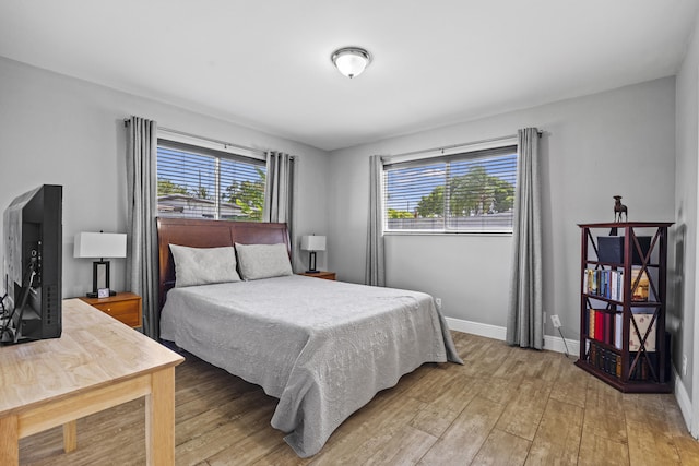 407 Riverside Dr, Palm Beach Gardens, FL 33410 - bedroom with light wood-type flooring and baseboards