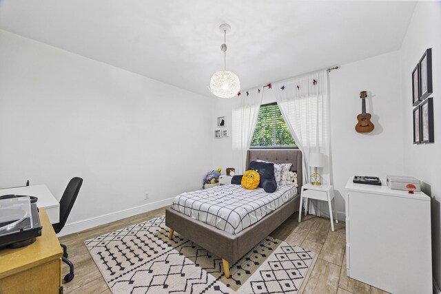 407 Riverside Dr, Palm Beach Gardens, FL 33410 - bedroom featuring light wood-type flooring and baseboards