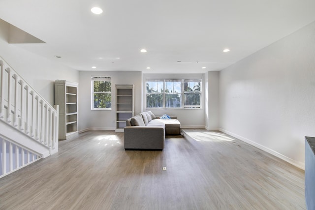 500 Pacific Grove 3 Dr Unit 3, West Palm Beach, FL 33401 - living room featuring baseboards, recessed lighting, light wood-type flooring, and stairway