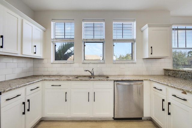 500 Pacific Grove 3 Dr Unit 3, West Palm Beach, FL 33401 - kitchen with dishwasher, a sink, plenty of natural light, and white cabinets