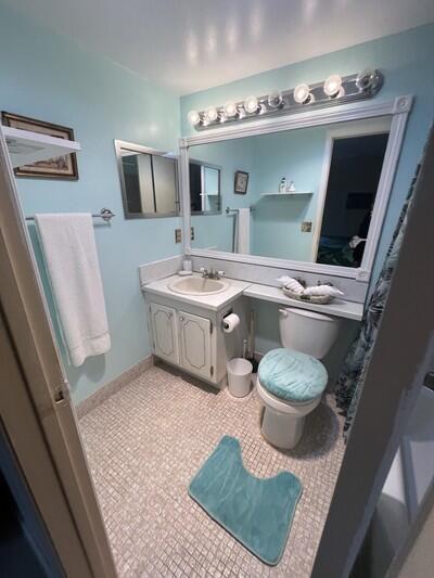 50 Berkshire B 50, West Palm Beach, FL 33417 - bathroom with toilet, vanity, and tile patterned flooring