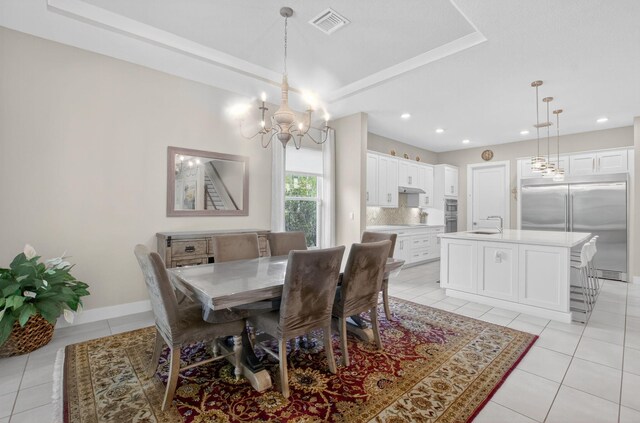4652 Saxon Rd, Coconut Creek, FL 33073 - dining space featuring a chandelier, light tile patterned floors, baseboards, a tray ceiling, and recessed lighting