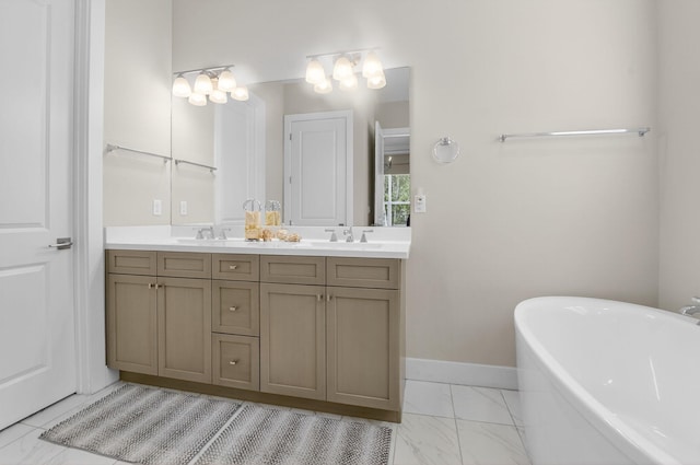 4652 Saxon Rd, Coconut Creek, FL 33073 - bathroom featuring marble finish flooring, double vanity, a soaking tub, and baseboards