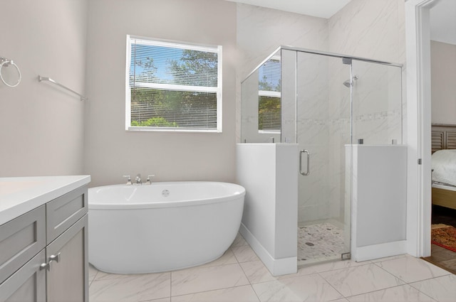 4652 Saxon Rd, Coconut Creek, FL 33073 - bathroom featuring marble look tiles, a soaking tub, a marble finish shower, and baseboards