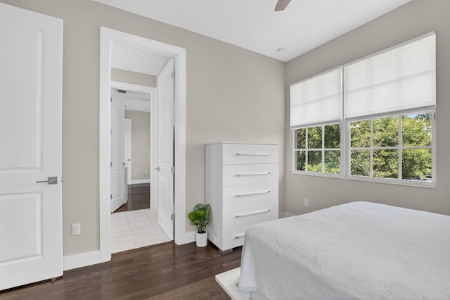 4652 Saxon Rd, Coconut Creek, FL 33073 - bedroom featuring dark wood-style flooring, baseboards, and a ceiling fan