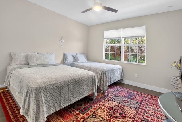 4652 Saxon Rd, Coconut Creek, FL 33073 - bedroom with baseboards, wood finished floors, and ceiling fan
