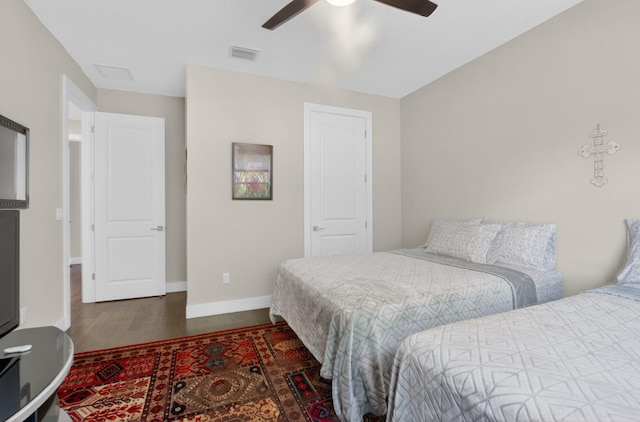4652 Saxon Rd, Coconut Creek, FL 33073 - bedroom with wood finished floors, baseboards, and ceiling fan