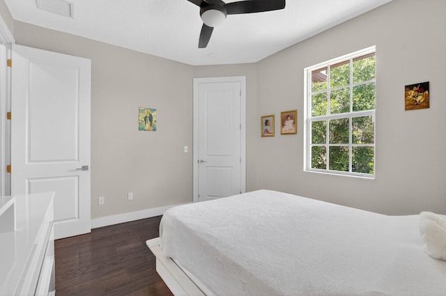 4652 Saxon Rd, Coconut Creek, FL 33073 - bedroom with dark wood finished floors, baseboards, and a ceiling fan