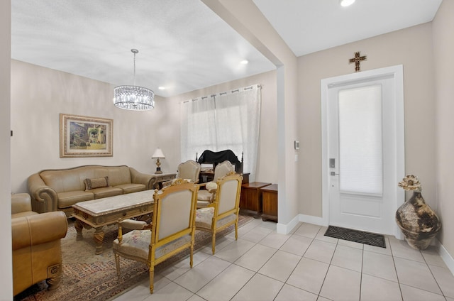 4652 Saxon Rd, Coconut Creek, FL 33073 - living area featuring light tile patterned floors, recessed lighting, a chandelier, and baseboards