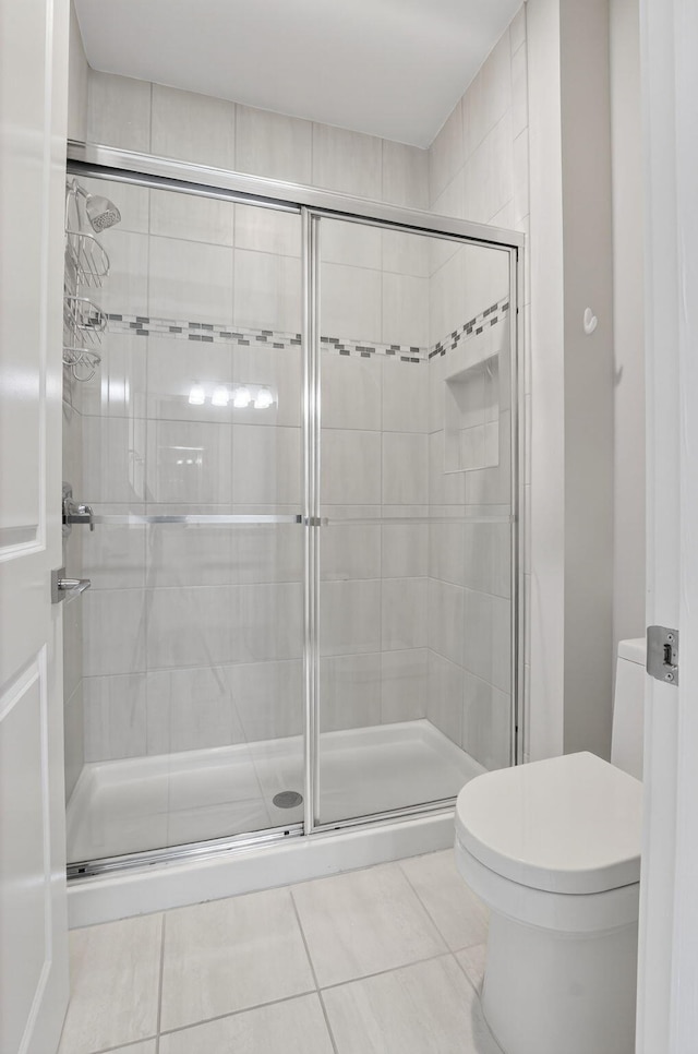 4652 Saxon Rd, Coconut Creek, FL 33073 - full bath featuring tile patterned floors, a stall shower, and toilet